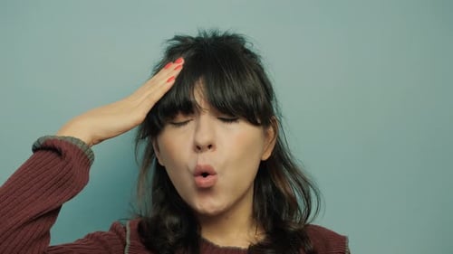 Woman Blowing on Drink, Smelling, and Drinking