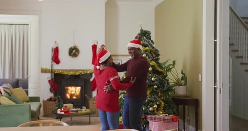 Mature Couple Dancing Joyfully at Christmas Time