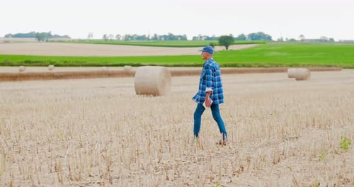 Farmer Using Digital Tablet on Field Agriculture