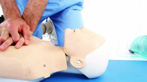 CPR Demonstration on Mannequin in Medical Workplace