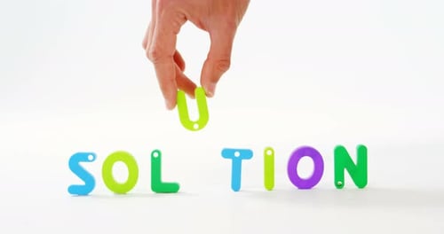 Hand Places Letter U to Spell Solution