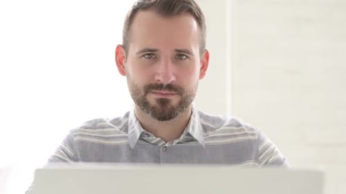 Bearded Man Giving Thumbs Up Gesture