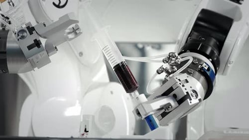 The Innovative Arms of a Robotic Arm Make an Injection of Chemotherapy for a Cancer Patient