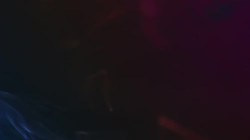 Abstract Colorful Smoke Plumes on a Dark Background