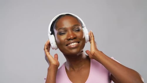 Woman Enjoys Music With Headphones On