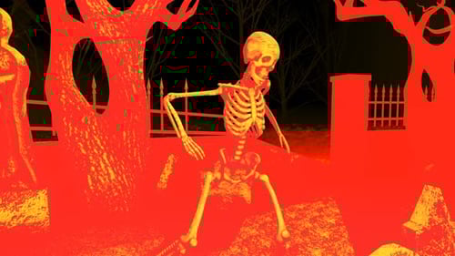 4K Red and yellow skeleton dancing in a cemetery