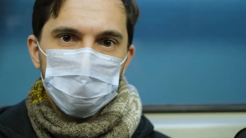 Man Wears Respiratory Mask Close-up. Coronavirus People. Pandemic Corona Virus.