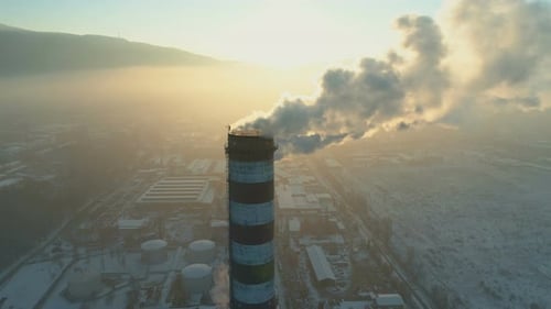 Air Pollution By Smoke Coming Out of Factory Chimney in the City.