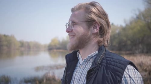 Bearded Man Looking at Amazing View of River and Forest