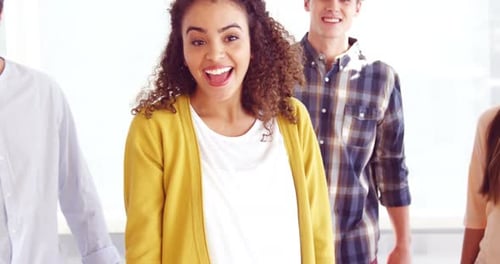 Diverse Young Adults Give Thumbs Up in Office