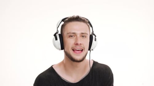 Man Listening to Music with White Headphones