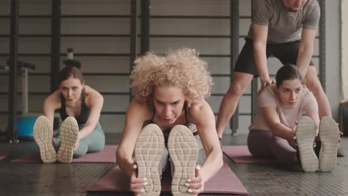 Women Doing Seated Forward Bend
