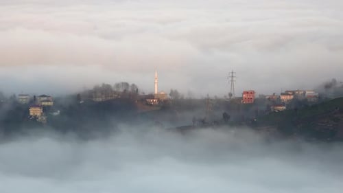 Fog Shrouded Rural Village at Sunrise