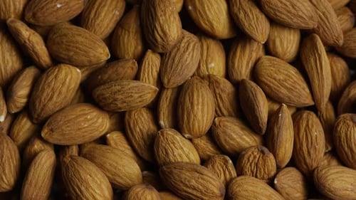 Cinematic, rotating shot of almonds on a white surface - ALMONDS 019