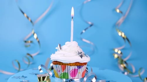Festive Cupcake with Candle on Rotating Surface