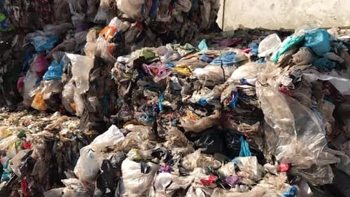 Compacted Block of Plastic Waste at Recycling Center