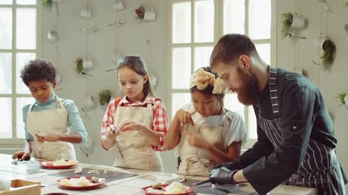 Chef and Children Cutting Champignons on Culinary Masterclass