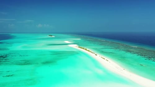 Aerial drone shot tourism of luxury seashore beach voyage by shallow ocean with white sandy backgrou