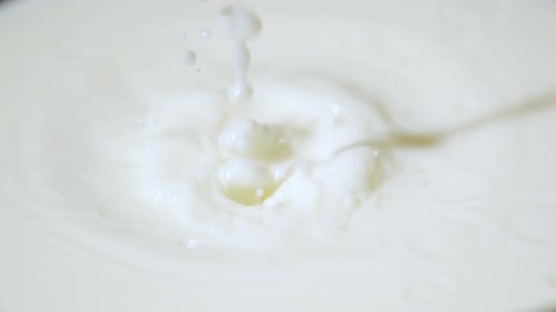 Extreme close up of a milk drop falling, Ultra Slow Motion
