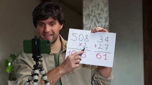 Young Adult Teaches Math Lesson with Smartphone