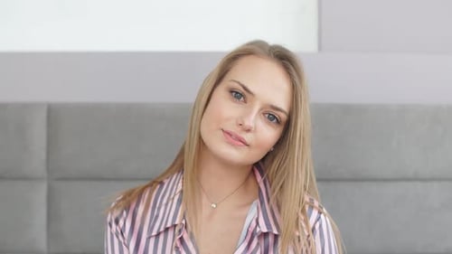 Blonde Woman Smiling and Tilting Head