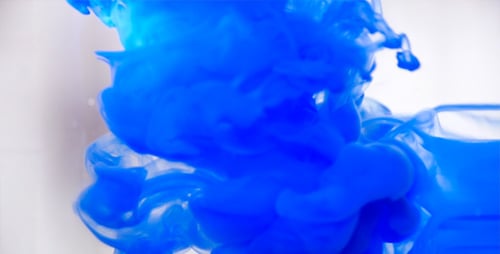 Swirling Blue Dye in Bright Liquid Abstract Art