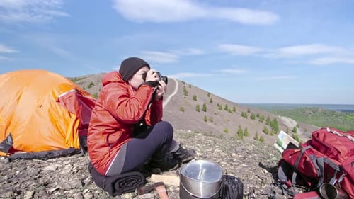 Woman Camping and Photographing Mountain View