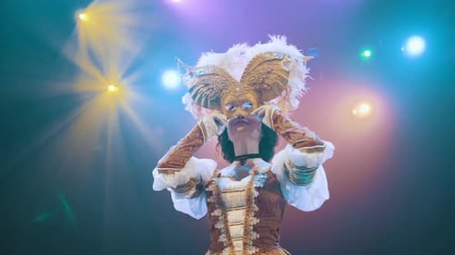 A theater actress wears a mask on stage. performance. actress. opera. performance