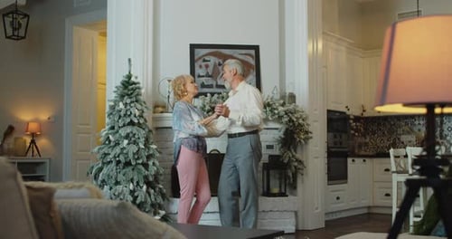 Senior Couple Share Romantic Dance at Christmas