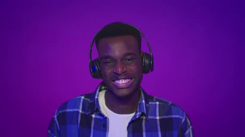 Young Adult Listening to Music on Headphones