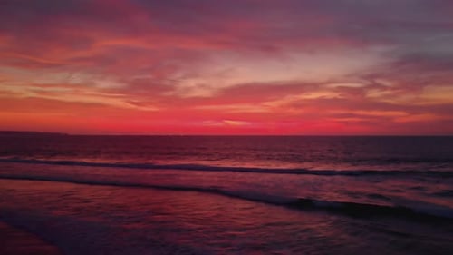 Flight at Sunset Overlooking the Indian Ocean in Bali Indonesia