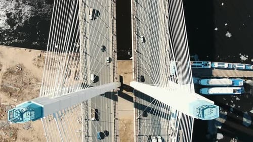 Over Cable-stayed Bridge Over the River Are Trucks and Cars, Aerial View