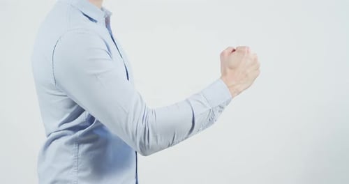 Person Raising Fist in a Display of Strength