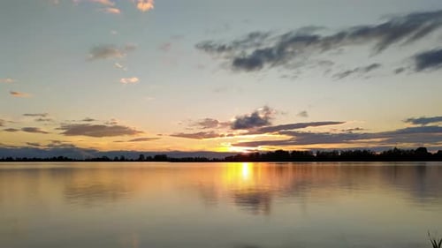 Golden Sunset Reflecting on a Calm Lake