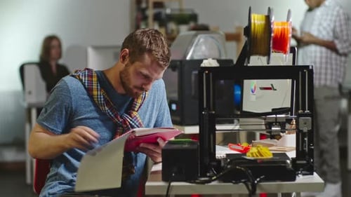 Engineer Working on FDM 3d Printer