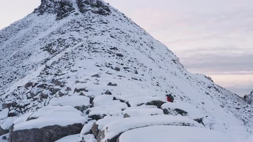 Drone Of Hiker Walking Up Mountain Side
