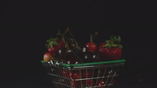 Red Fresh Strawberries and Cherries in a Little Trolley From a Super Layout