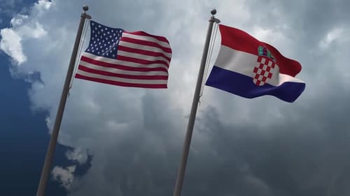 Waving Flags of United States and Croatia Against Cloudy Sky