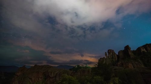Milky Way galaxy, moving clouds, plane trails and meteor shower, during Perseid stream