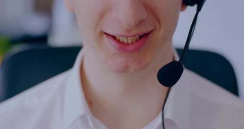 Close Up of Smiling Young Adult with Headset