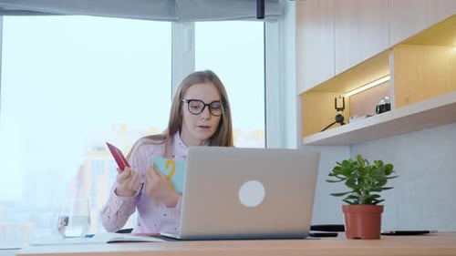 Young Woman Teaching Numbers Online With Laptop