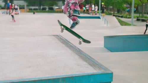 Skateboarder Performing a Trick at an Urban Skatepark