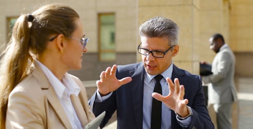 Business People Discussing Outside on Sunny Day