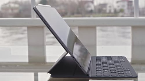 Tablet with Keyboard Displayed in Urban Setting
