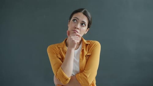 Woman Deep in Thought Posing in Studio