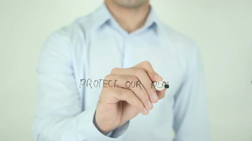 Writing Protect Our Planet on Glass Surface