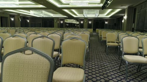 Empty Conference Hall with Rows of Chairs