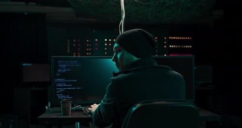 Young Adult Coding in Dark Room