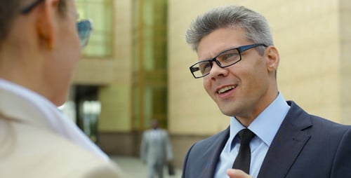 Business People Talking Holding Coffee Outside Office