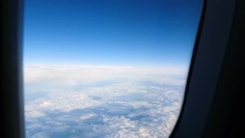 View from a plane above the clouds